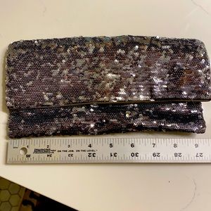 BCBG carbon color sequin clutch, with strap.